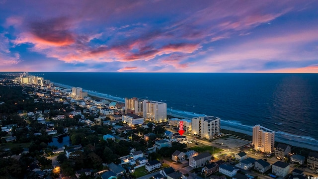 aerial view at dusk with a water view