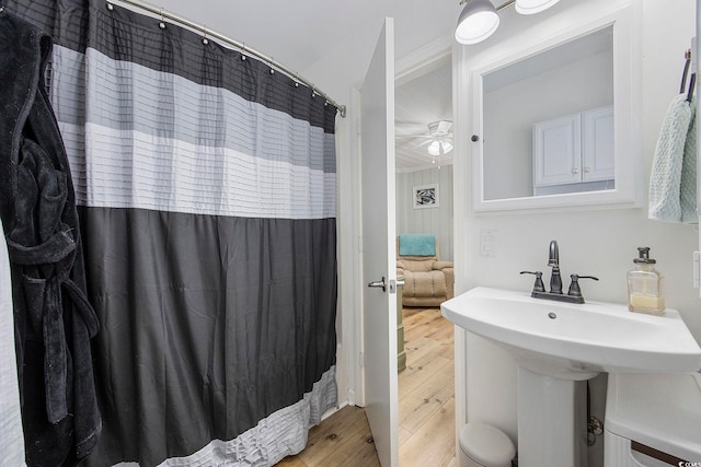 bathroom featuring wood-type flooring and ceiling fan