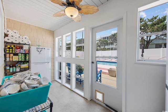 sunroom featuring wood ceiling and ceiling fan