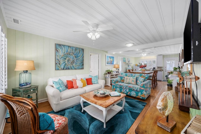 living room with hardwood / wood-style flooring, wooden ceiling, and ceiling fan