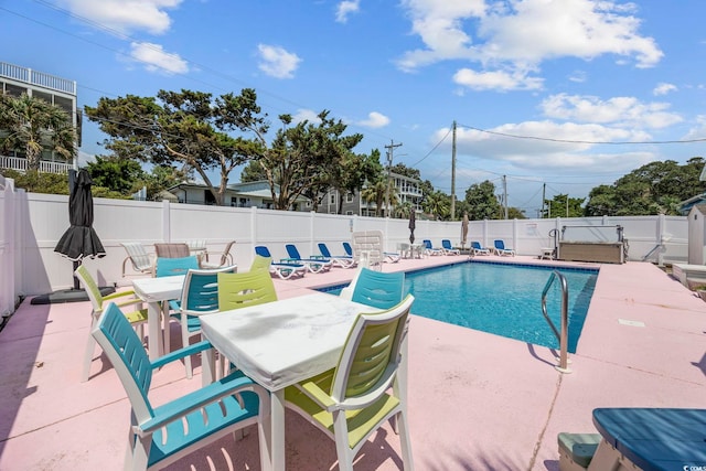 view of swimming pool featuring a patio area