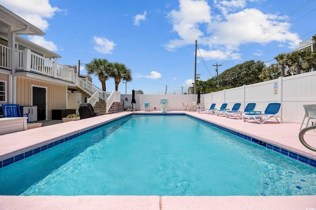 view of pool featuring a patio