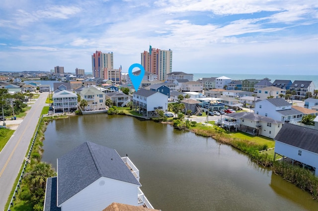 aerial view with a water view and a city view