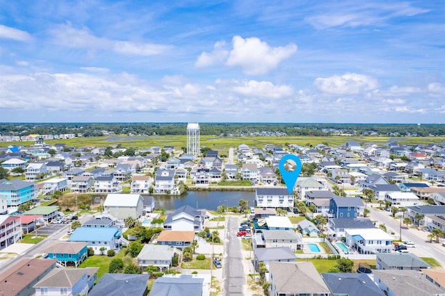 birds eye view of property with a water view and a residential view