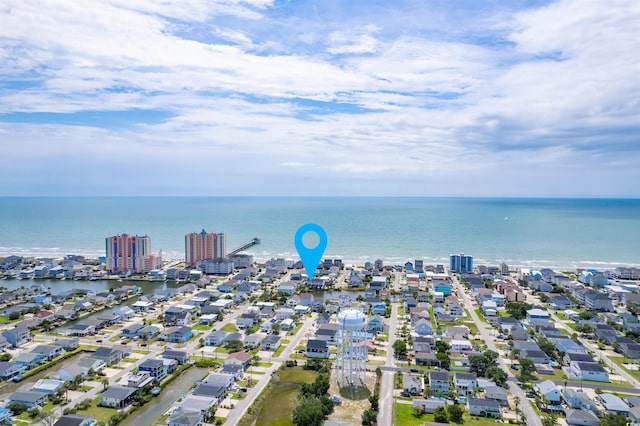 birds eye view of property featuring a water view and a city view