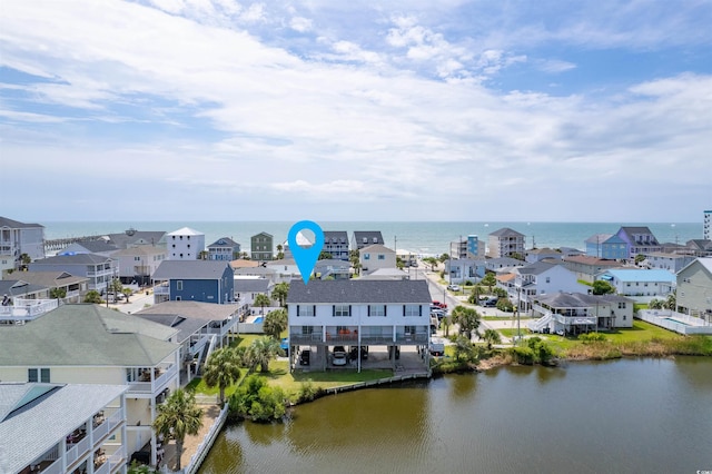 birds eye view of property with a residential view and a water view