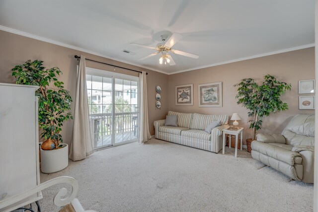 carpeted living room featuring ceiling fan and crown molding