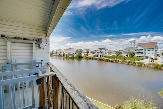 exterior space featuring a water view and a residential view