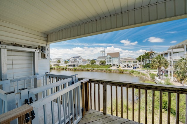 deck featuring a water view and a residential view