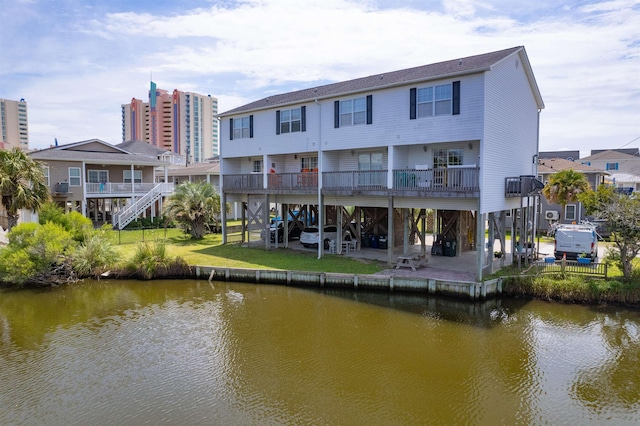 rear view of house with a water view