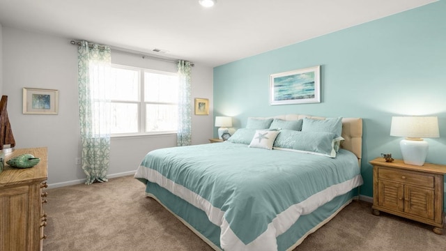 bedroom with light colored carpet