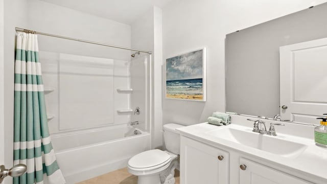 full bathroom featuring shower / bath combo, vanity, and toilet