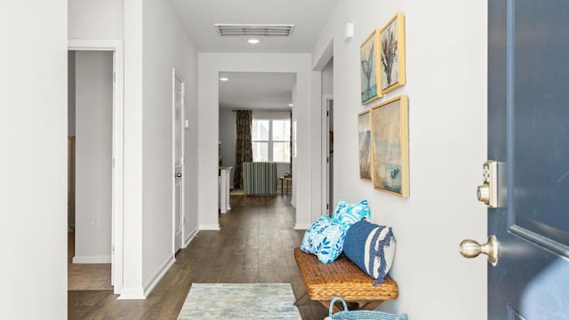 corridor featuring dark hardwood / wood-style flooring