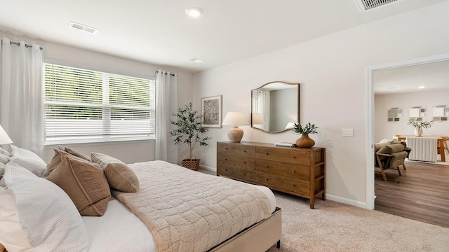 bedroom with light carpet