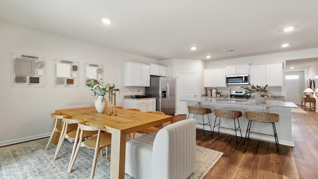 dining room with dark hardwood / wood-style floors