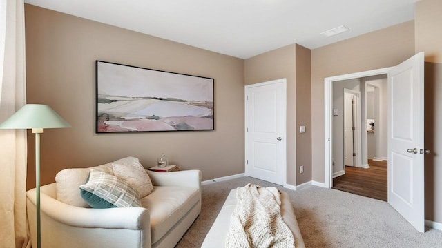 living area featuring carpet flooring