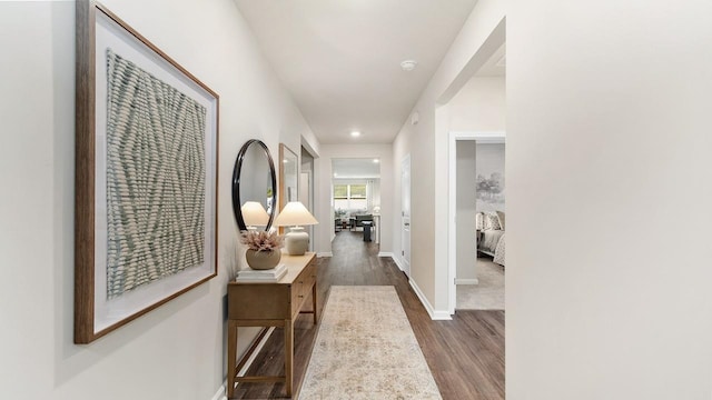 hall with dark hardwood / wood-style floors