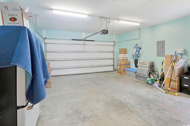 garage featuring electric panel and a garage door opener