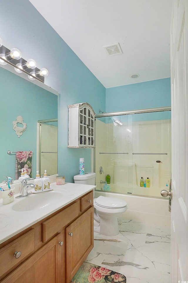 full bathroom with toilet, bath / shower combo with glass door, and vanity