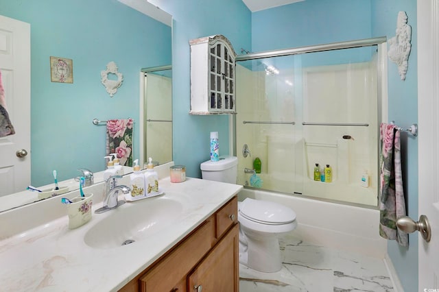 full bathroom featuring vanity, toilet, and shower / bath combination with glass door