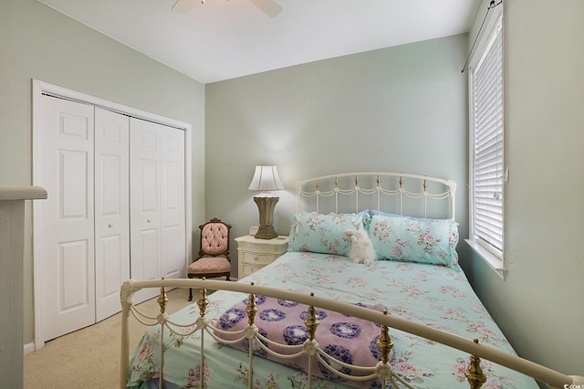 bedroom with a closet, carpet, and ceiling fan