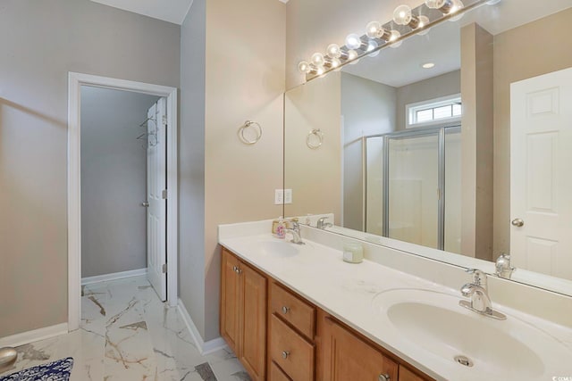 bathroom featuring vanity and an enclosed shower