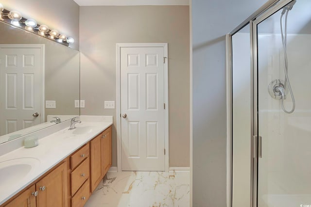 bathroom featuring vanity and a shower with shower door