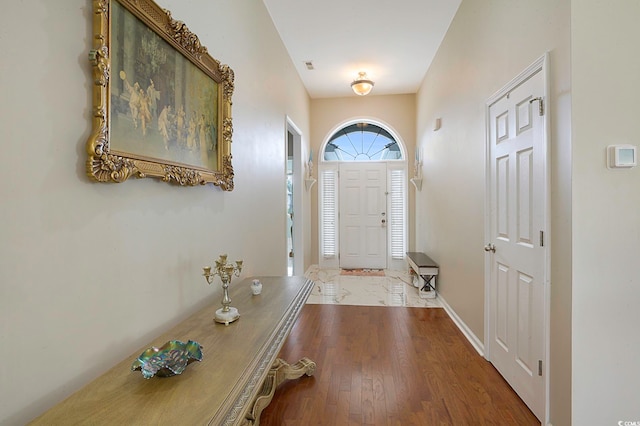 foyer entrance with wood-type flooring