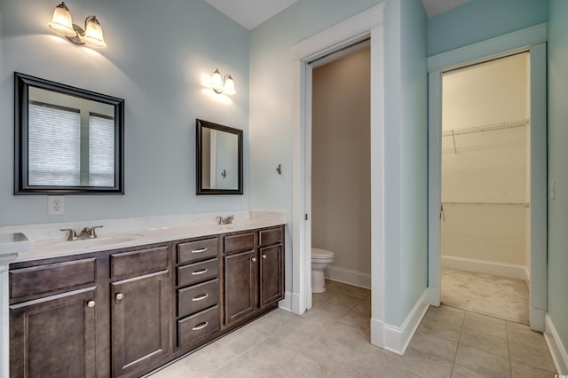 1348 Peterson St, Myrtle Beach, SC 29577 - bathroom with toilet, double vanity, tile patterned floors, and baseboards