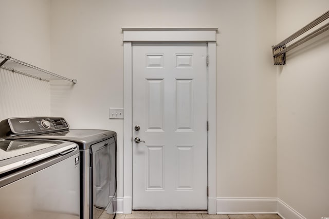 1348 Peterson St, Myrtle Beach, SC 29577 - laundry area with washer and clothes dryer, baseboards, and light tile patterned floors