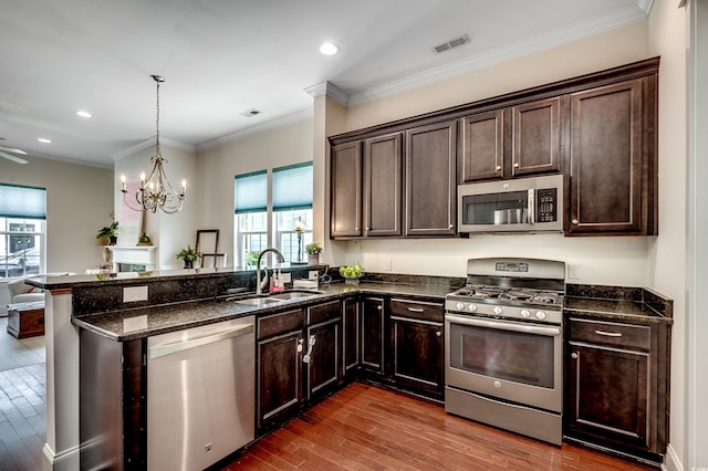 1348 Peterson St, Myrtle Beach, SC 29577 - kitchen with appliances with stainless steel finishes, a sink, dark wood-type flooring, healthy amount of natural light, and recessed lighting