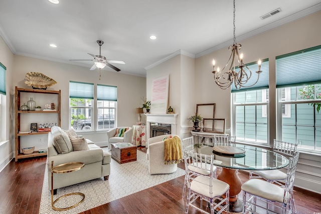 1348 Peterson St, Myrtle Beach, SC 29577 - dining space featuring ornamental molding, dark wood-style flooring, ceiling fan, recessed lighting, and a fireplace