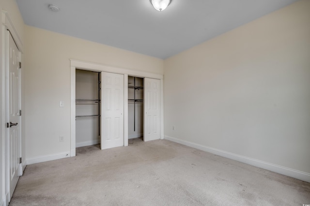 1348 Peterson St, Myrtle Beach, SC 29577 - unfurnished bedroom featuring light colored carpet, baseboards, and two closets