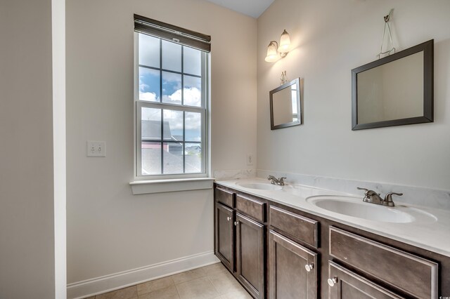 1348 Peterson St, Myrtle Beach, SC 29577 - full bathroom with plenty of natural light, double vanity, tile patterned floors, and baseboards