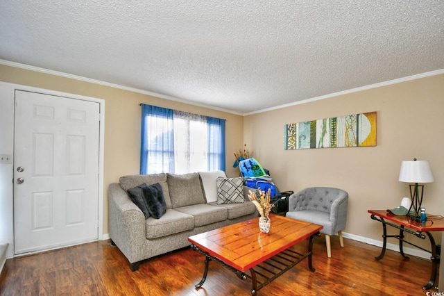 living area with ornamental molding, a textured ceiling, baseboards, and wood finished floors