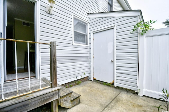 property entrance with a patio