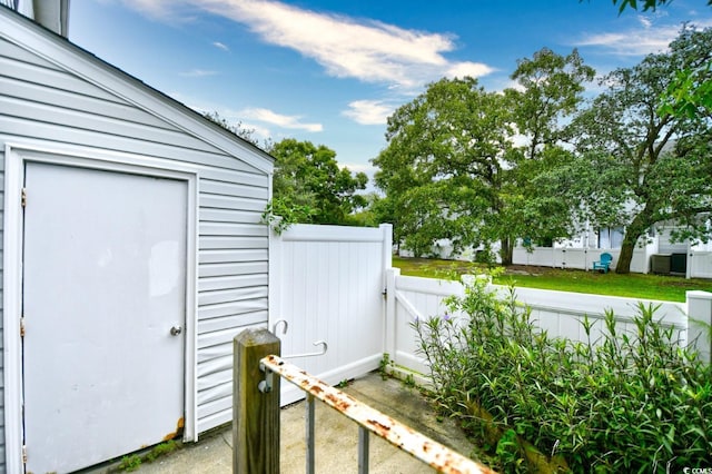 entrance to property featuring fence