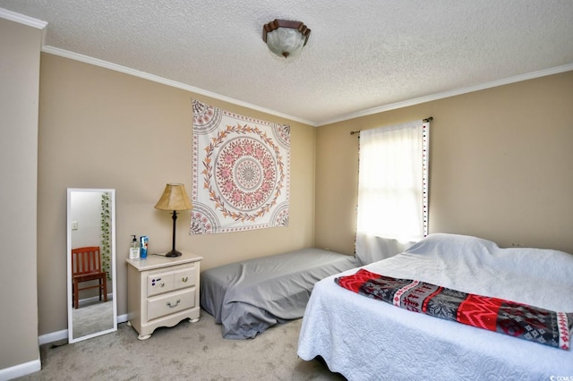 carpeted bedroom with a textured ceiling and crown molding