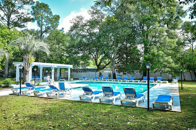 pool featuring a yard, a patio, fence, and a pergola