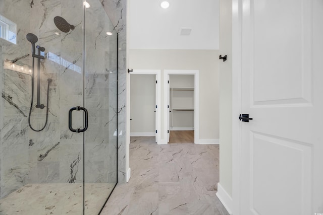 bathroom with a shower with shower door