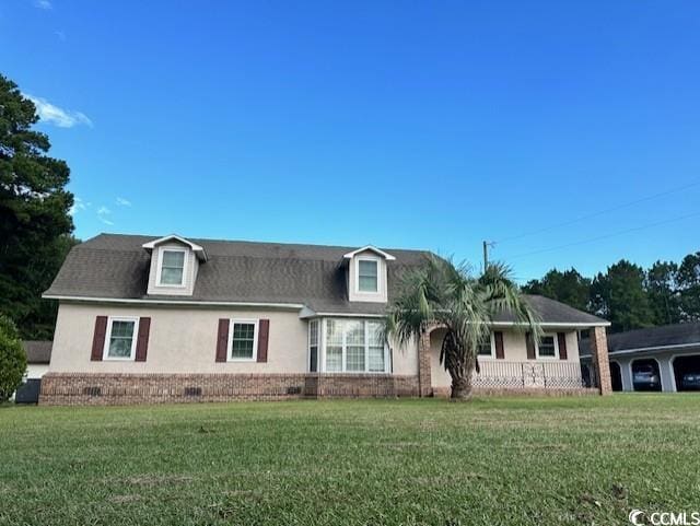 view of front of house with stucco siding and a front yard