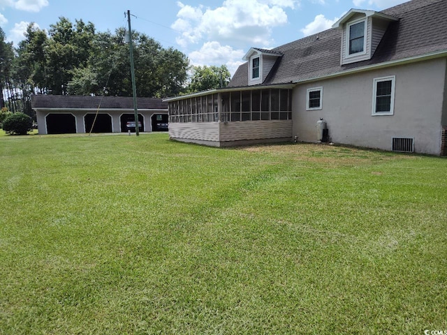 view of yard with a sunroom