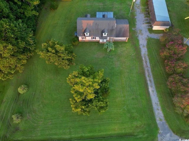 birds eye view of property with a rural view