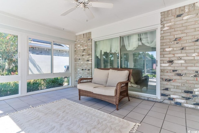 sitting room featuring plenty of natural light, ceiling fan, and light tile patterned flooring