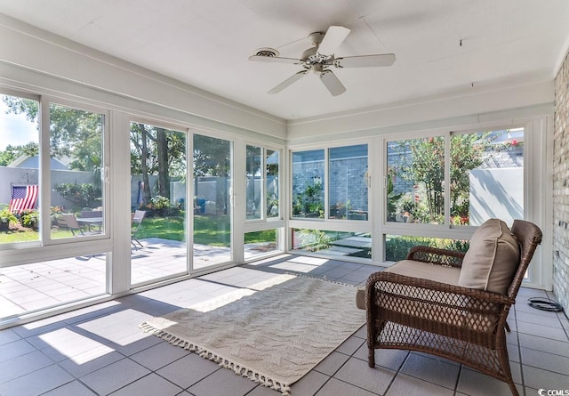 sunroom with plenty of natural light and ceiling fan