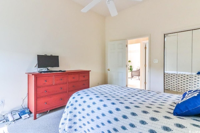 carpeted bedroom featuring ceiling fan and a closet