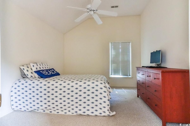 bedroom with lofted ceiling, ceiling fan, and light carpet