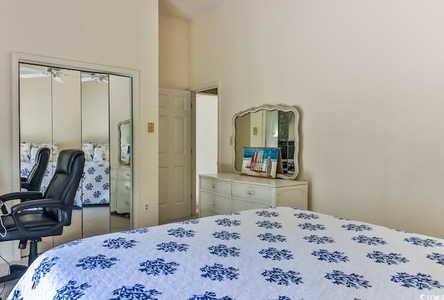 carpeted bedroom featuring a towering ceiling and a closet