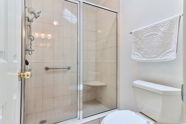 bathroom with walk in shower and toilet