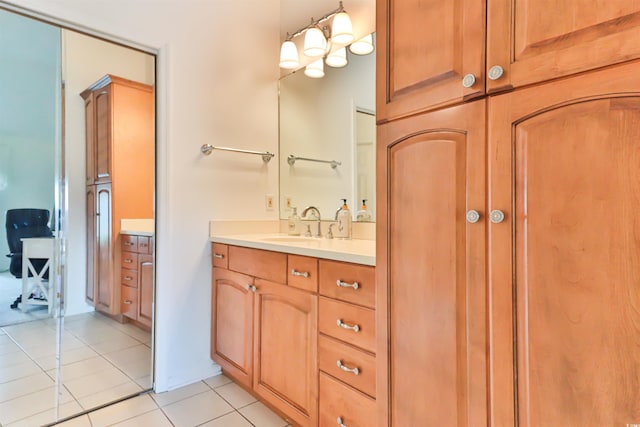 bathroom featuring tile patterned flooring and vanity